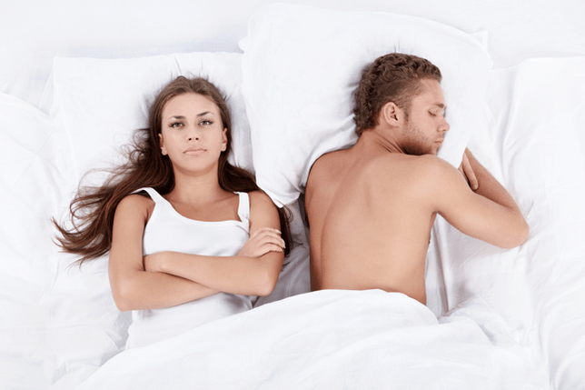 a woman in bed with a man of low potential