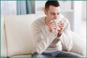 A man drinks tea with mint to treat erectile dysfunction. 
